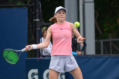 Toronto, ON, Canada - August 4, 2024: Katie Volynets (USA) plays against Yuriko Miyazaki (GBR) during the National Bank Open qualifying match at Sobeys Stadium. clipart