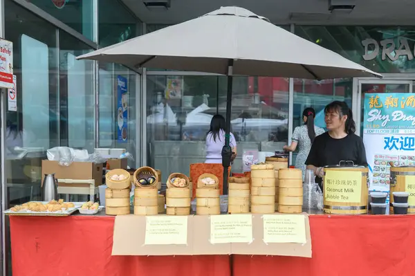 stock image Toronto, ON, Canada - August 17, 2024: Chinatown festival food vendors present they product on Spadina Avenue at the Toronto Chinatown Festival 2024.