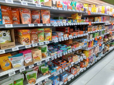 Toronto, On, Canada - August 23, 2024: Indoor view of the shelves in No Frills  grocery store in Canada. clipart