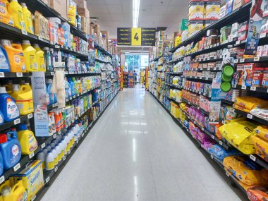 Toronto, On, Canada - August 23, 2024: Indoor view of the shelves in No Frills  grocery store in Canada. clipart