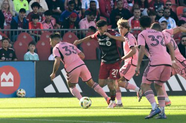 Toronto, ON, Canada - October 5, 2024: Jonathan Osorio #21 midfielder of Toronto FC tries to move with the ball during the 2024 MLS Regular season match between Toronto FC (Canada) v Inter Miami CF (USA) at BMO Field. clipart