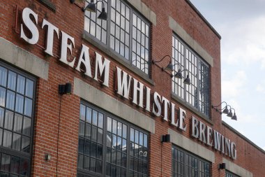 Toronto, ON, Canada  August 3, 2024:  View at the Steam whistle beer brewery company sign.. clipart