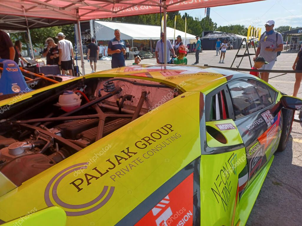 Toronto, ON, Canada  July 19, 2024: A GTA Exotics race car is on display at the Honda Indy event at Exhibition Place with vibrant sponsor branding..