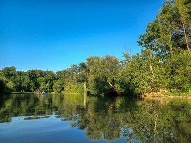 : View of the Humber River under a clear blue summer sky.