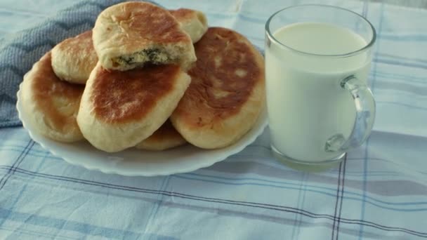 Glass Fresh Milk Plate Ruddy Golden Fried Homemade Pies One — Stock Video