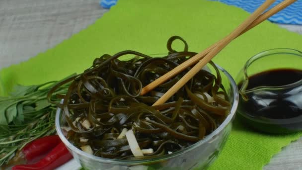 Seaweed Kelp Salad Onion Soy Sauce Bowl Wooden Chopsticks Green — Stockvideo