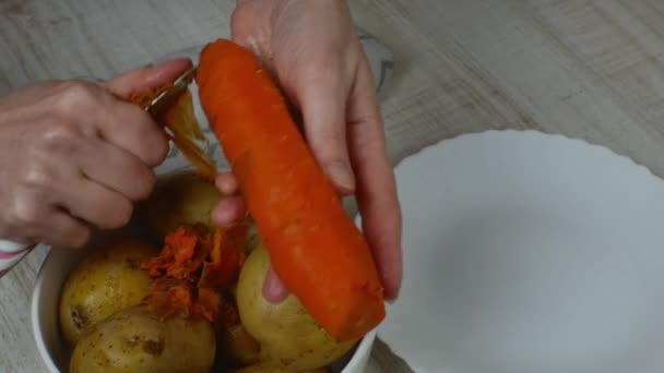 Peeling Orange Boiled Carrots Housewife Cleans Red Boiled Carrots Iron — Video Stock