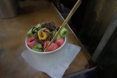 Smoky snacks, made of chocolate-coated crackers and given dry ice