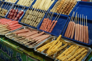 A variety of sausages and nuggets for frying