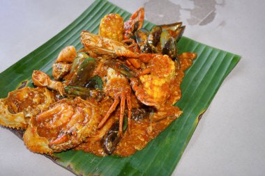 Crab seafood with sauce on a banana leaf