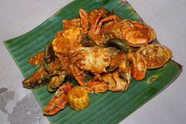 Crab seafood with sauce on a banana leaf