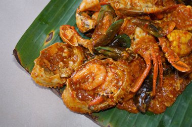 Crab seafood with sauce on a banana leaf