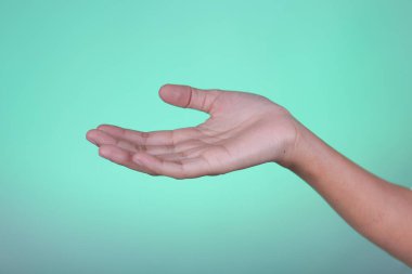 The right palm looks up against the cyan background