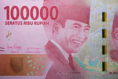 A replica of the Indonesian currency, a 100,000 rupiah note