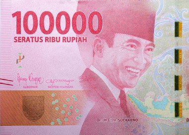 A replica of the Indonesian currency, a 100,000 rupiah note