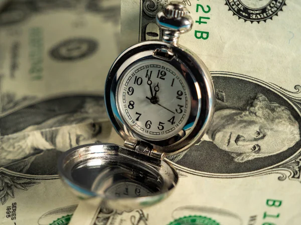 stock image Old pocket watches lie on dollar bills. Close-up.