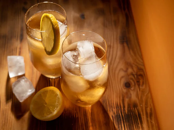 stock image Iced tea in a glass with ice cubes. Cold tea with ice. Close up.