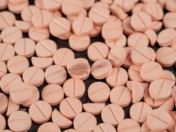 stock image Lots of pink pills. Background from pink pills. medicine in tablets. Close-up.