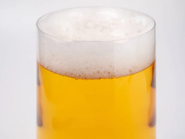 stock image Glass of beer on a white background. A glass of light beer with foam. close-up.