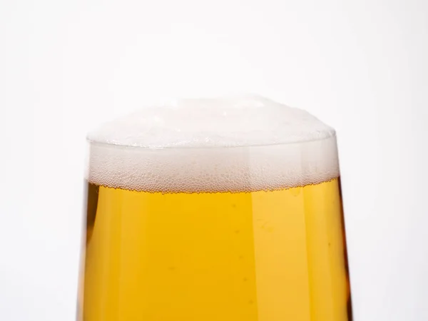 stock image Glass of beer on a white background. A glass of light beer with foam. close-up.
