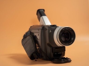 Vintage retro video camera, tape recorder, close-up object. Outdated old technology, film production, cinema equipment concept. Close-up.