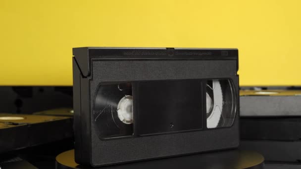 Rotating Old Vhs Cassettes Yellow Background Retro Video Cassettes Close — Video