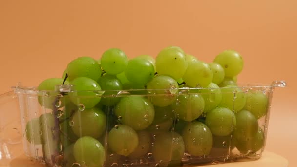 Rotating Green Grapes Ripe Grapes Orange Background Close — Video
