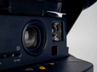 Vintage instant camera with selective focus, instant camera isolated on white background. Close-up.