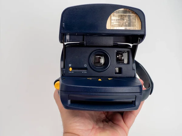 Vintage instant camera with selective focus, instant camera isolated on white background. Close-up.