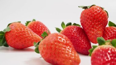 Ripe strawberries on a white background. Strawberries close up.