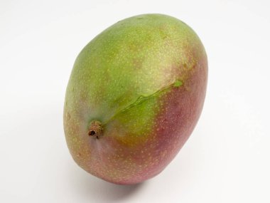 Ripe mango on a white background. Fresh mango. Close-up.