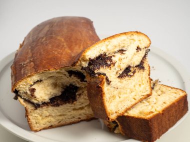 Freshly baked bread with poppy seeds. Close-up.