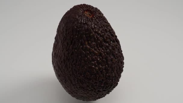 Ripe Avocado Rotates White Background Fresh Avocado Close — Vídeo de stock