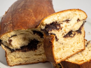 Freshly baked bread with poppy seeds. Close-up.