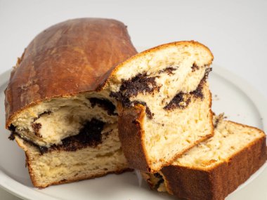 Freshly baked bread with poppy seeds. Close-up.
