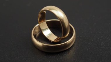 Wedding rings on a white background. Gold rings. Close-up.