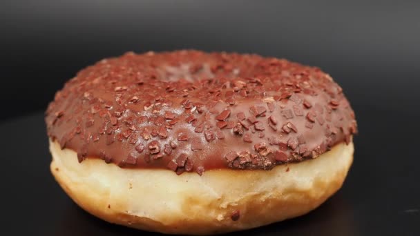 Rotating Chocolate Donut Chocolate Chips Black Background Close — Vídeo de Stock