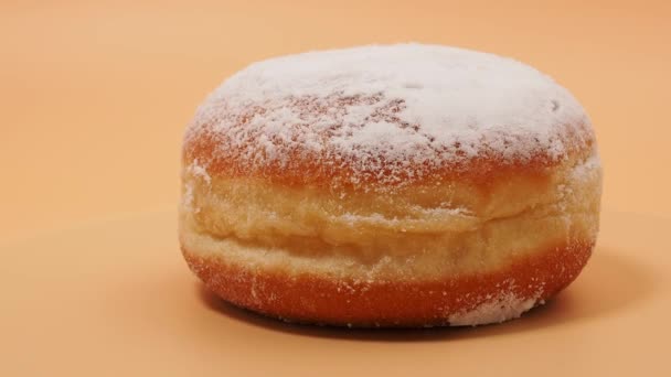 Freshly Baked Powdered German Donuts Berlin Donut Krapfen Orange Background — Stockvideo