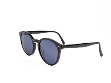 Stylish sunglasses. Sunglasses in a dark frame on a white background. Close-up.