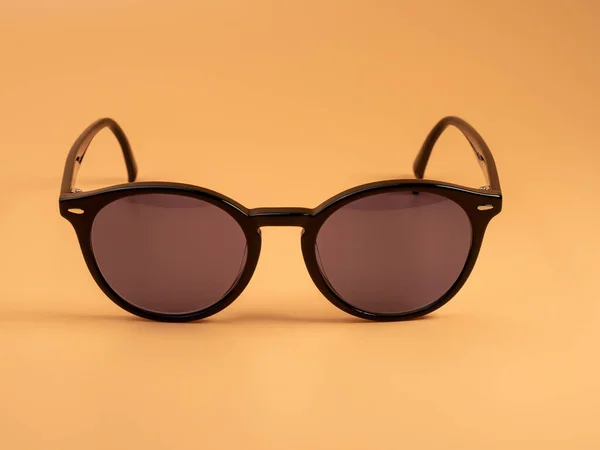 Stylish Sunglasses Sunglasses Dark Frame Orange Background Close —  Fotos de Stock