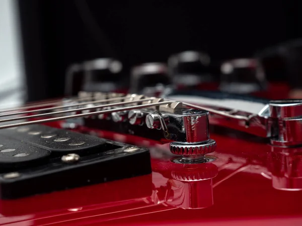 Red electric guitar. Electric guitar settings. Red guitar. Close-up.
