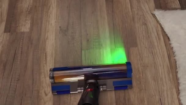 Woman Vacuums Modern Vacuum Cleaner Green Illumination House Cleaning — Stock Video