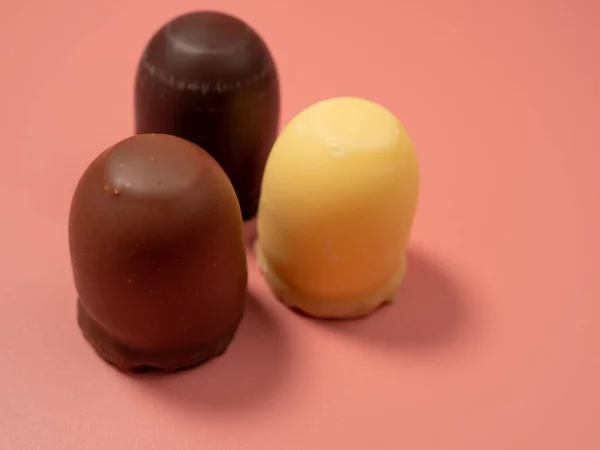 stock image Chocolate covered marshmallow on a pink background. Close-Up.