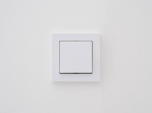 Modern light switch in the wall. European light switch.