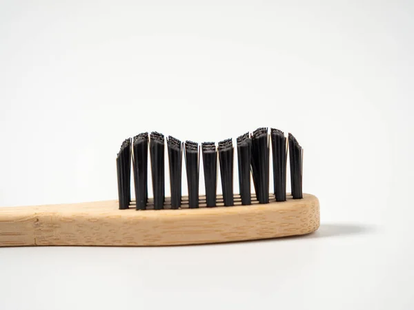 stock image Bamboo toothbrush. Wooden toothbrush on a white background. Toothbrush close-up.