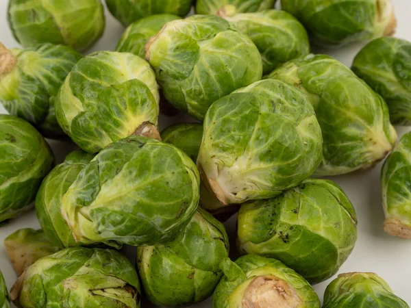 Brussels sprouts on a white background. Fresh, small Brussels sprouts on a white isolated background.