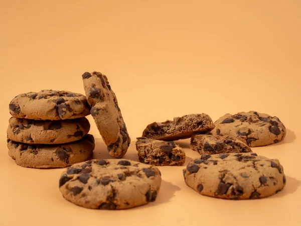 Oatmeal cookies with chocolate chips on an orange background. Classic oatmeal cookies with chocolate.