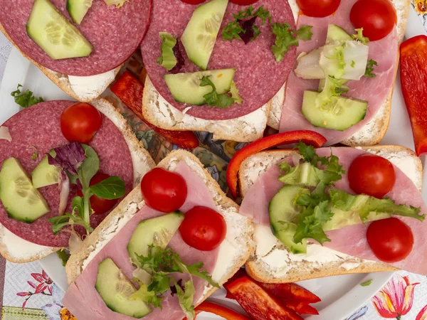 Traditional open sandwiches with salad. Sandwiches close-up.