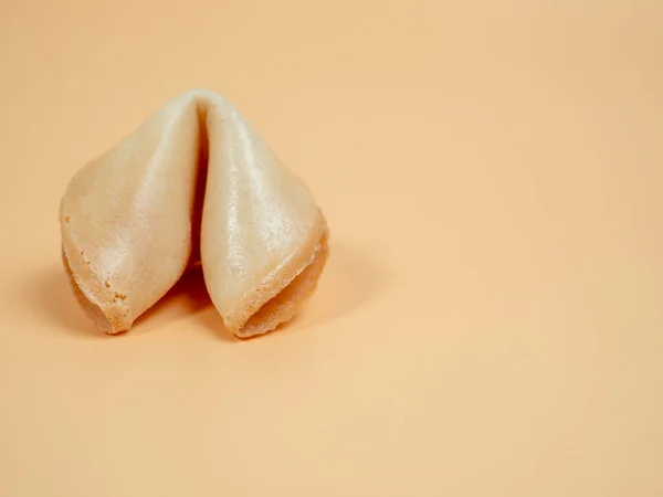 Fortune cookies on an orange background. Fortune cookies close up.