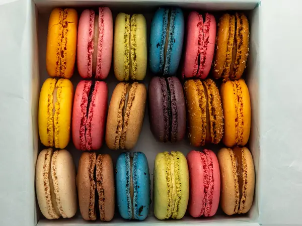 Packaging of Colorful French Macaroons. French macaroons close-up.